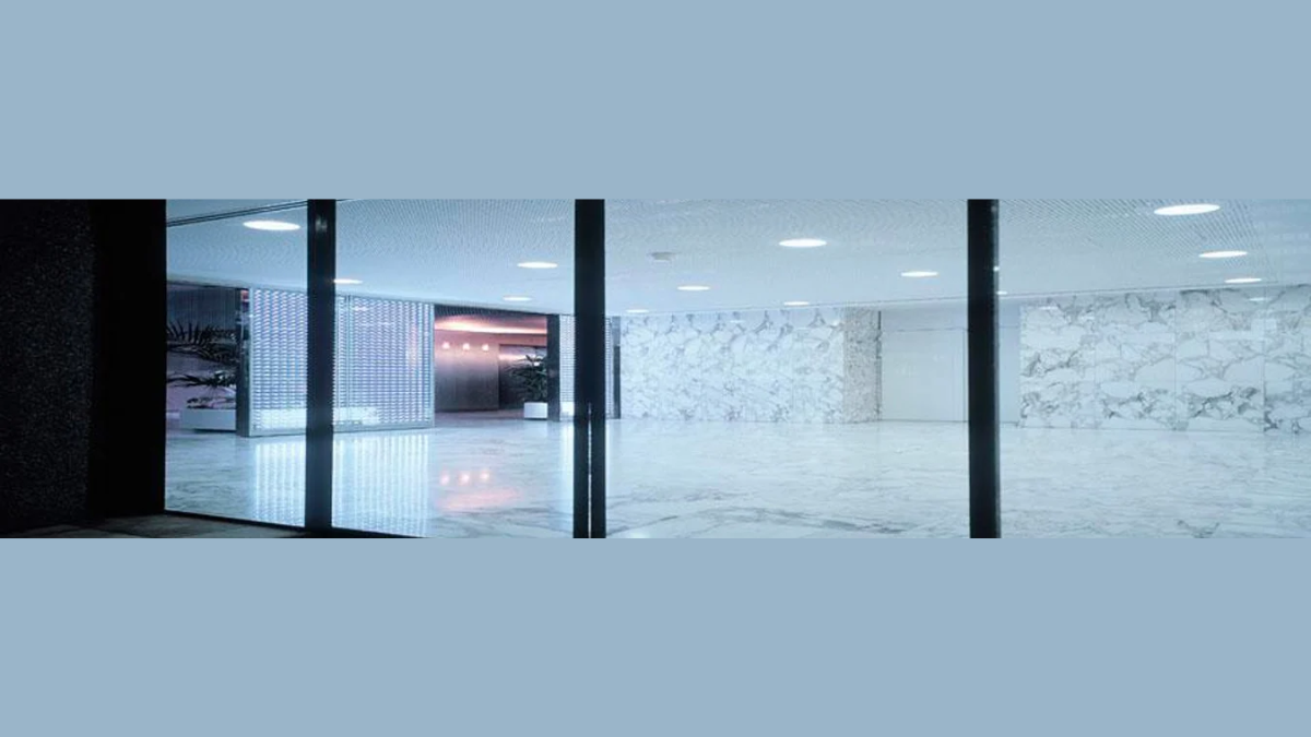 Modern, spacious living room with a premium, large sliding patio door system open to the exterior, emphasizing natural light and flow.